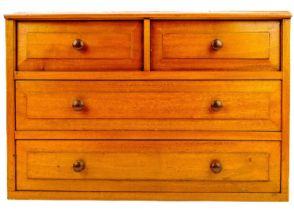 An Arts and Crafts walnut small collector's chest.