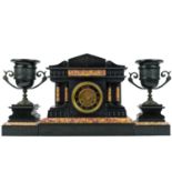 A French black slate and marble clock garniture.