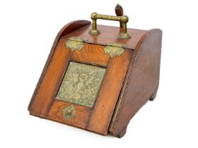 A late Victorian aesthetic movement elm and brass coal scuttle.