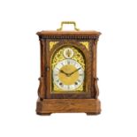 A German Winterhalder and Hofmeier oak cased chiming bracket clock.