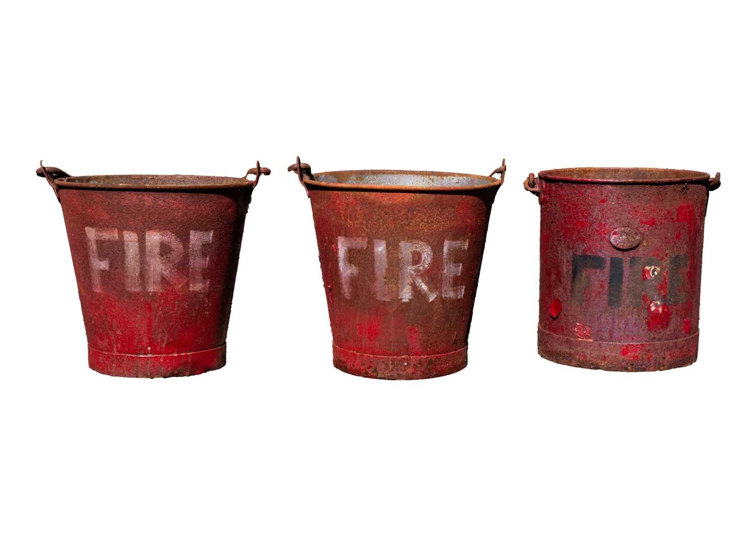 Three red painted metal 'FIRE' buckets.