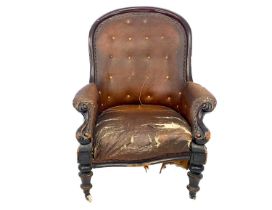 A Victorian mahogany button back armchair.
