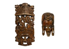 An Aztec style carved wood mask.