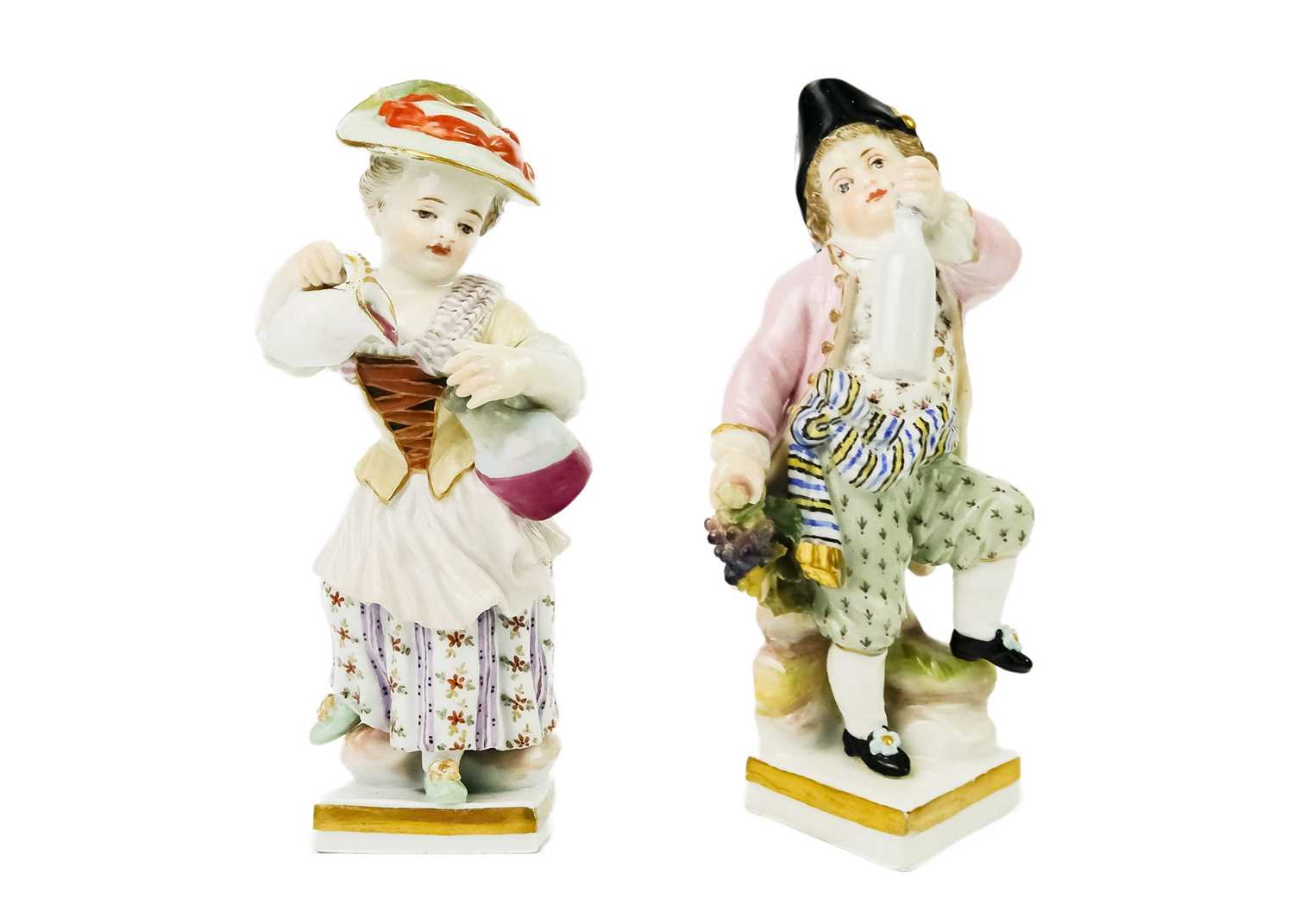 A pair of Meissen porcelain figures of child vintners.