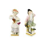 A pair of Meissen porcelain figures of child vintners.