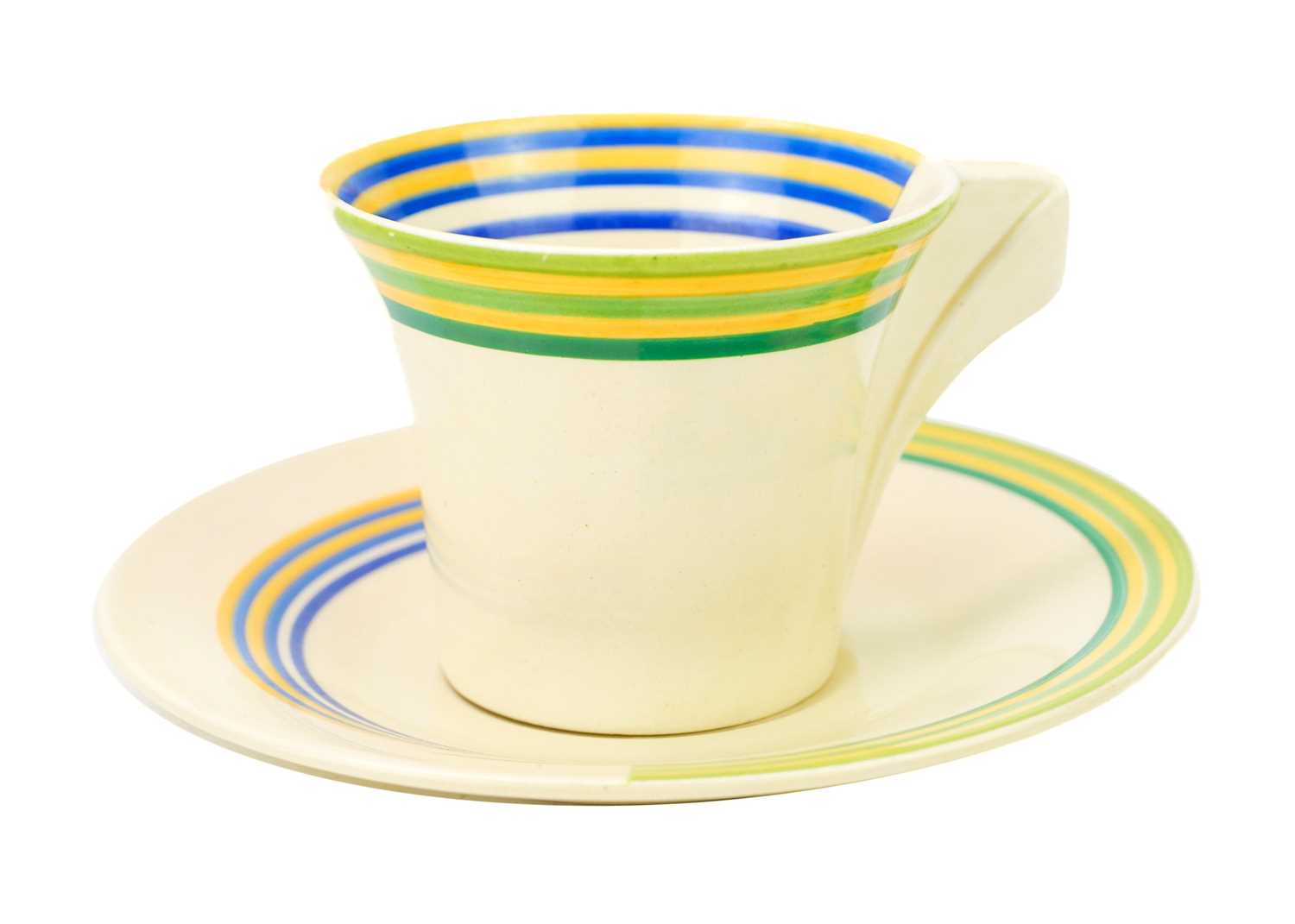 A Clarice Cliff Banded pattern daffodil shape cup and saucer.