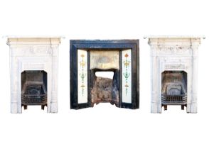 A Victorian cast iron and brass fire insert, with tiled panels.