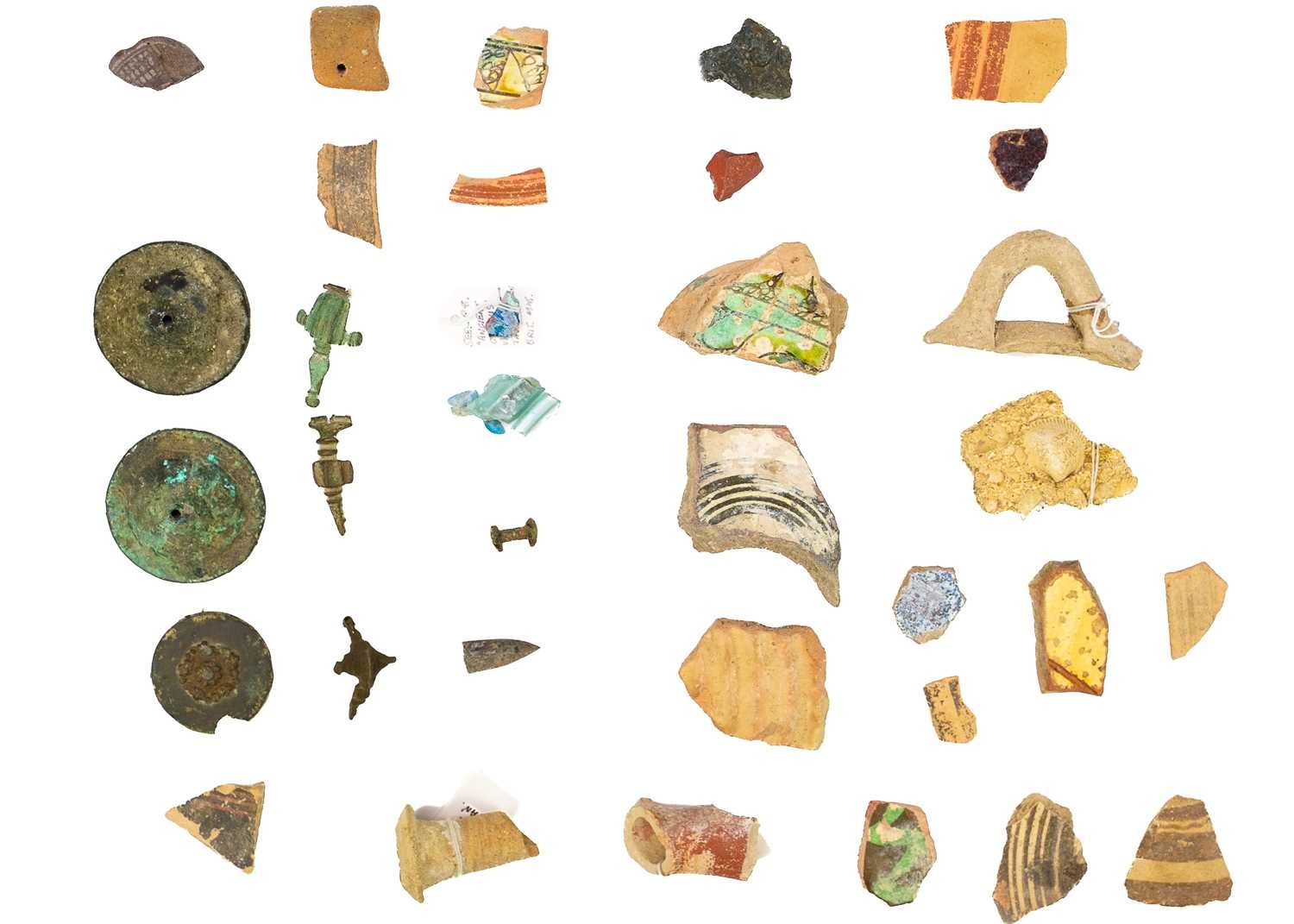 A group of Cypriot pottery shards and glass fragments.