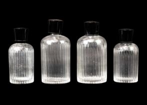 A pair of Art Deco cut glass scent bottles and stoppers.