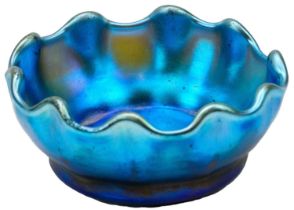 A Tiffany Favrile iridescent blue glass salt or miniature bowl