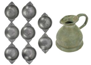 A set of seven 20th century twin handle pewter porringer bowls with pierced handles.