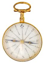 An early 19th century gilt brass compass with enamel dial and blue steel needle.