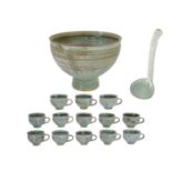 Louis Hanssen (1934-1968) A studio pottery punch bowl, with ladle, and thirteen cups.