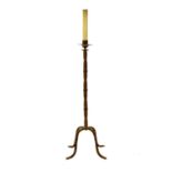 A wrought iron candle stand.