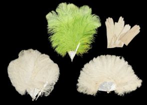 A lime green ostrich feather fan with mother-of-pearl guard sticks.