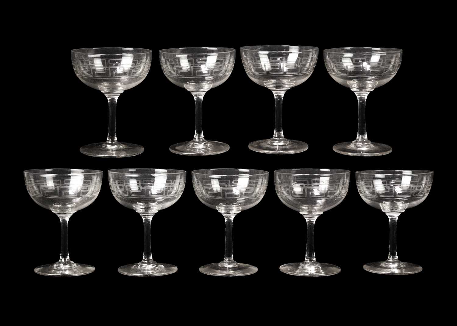 A set of nine Edwardian glass champagne tazzae.