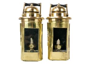 A pair of early 20th century brass ship binnacles.