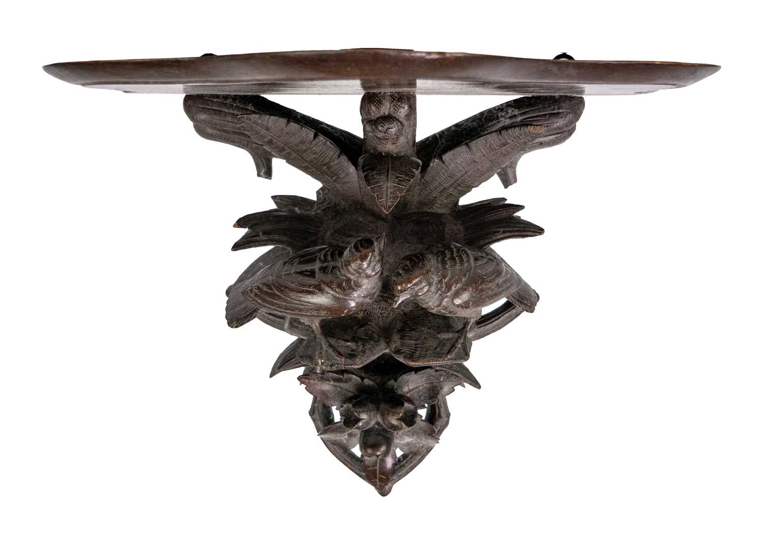 A Black Forest carved wall bracket.