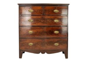 A 19th century flame mahogany bow front chest of drawers.