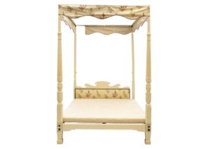 A late Victorian mahogany painted four poster bed.