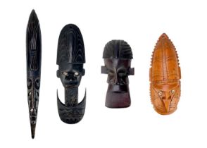 Four Oceania carved masks.