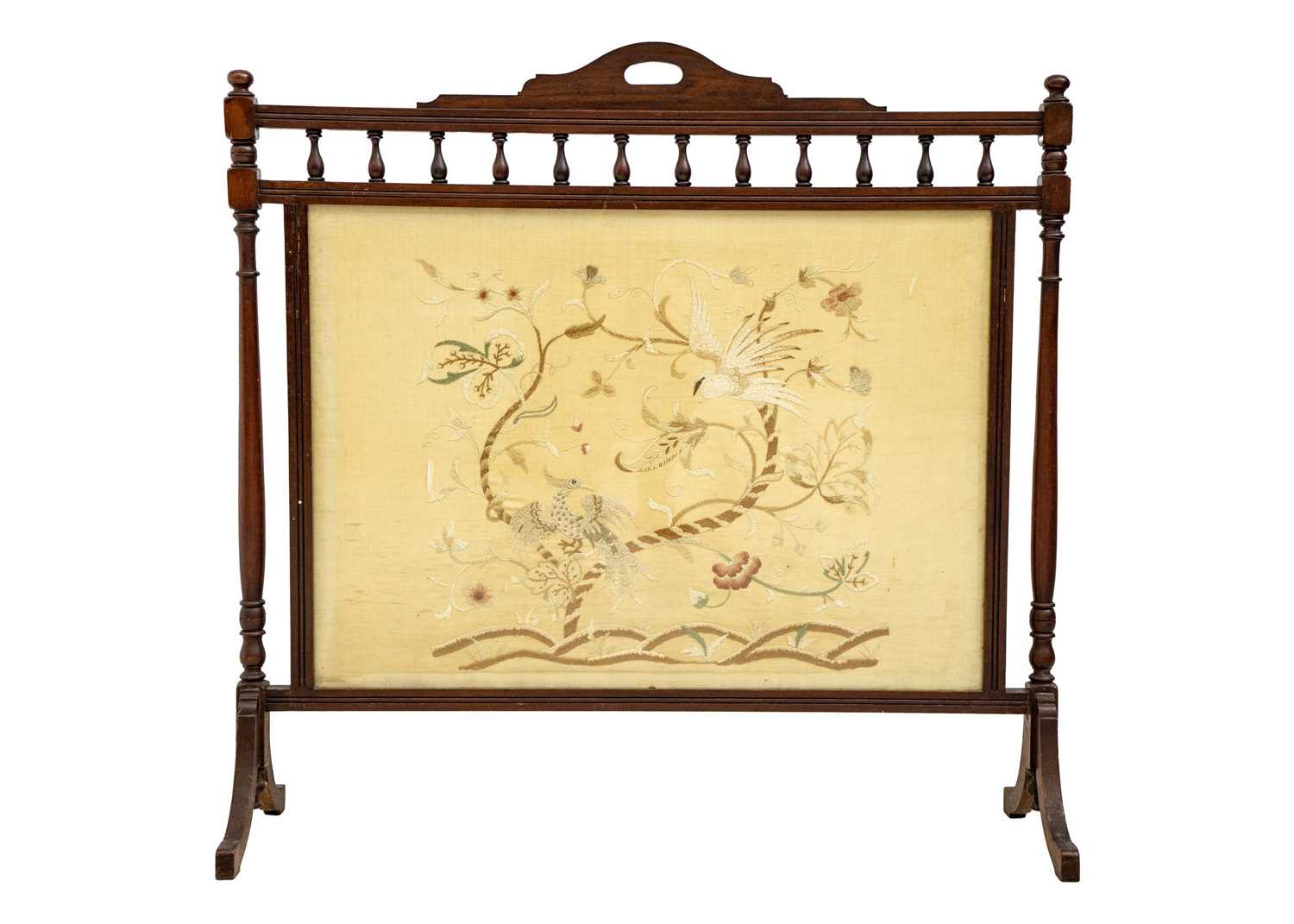 An Edwardian walnut wide fire screen.