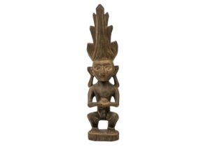 A wood carved ancestor figure Adu Zatua.