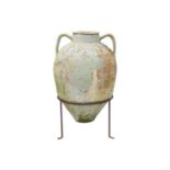 A twin handled terracotta olive jar, with traces of cream and green paint.