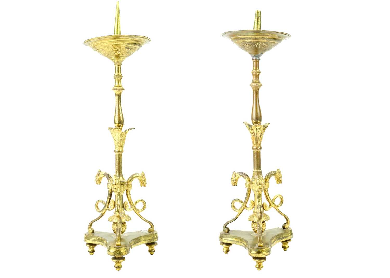 A pair of brass pricket type ecclesiastical candlesticks.