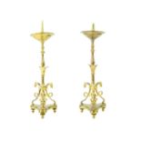 A pair of brass pricket type ecclesiastical candlesticks.