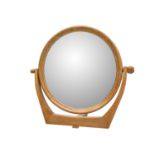 A mid century walnut inlaid circular dressing table mirror.