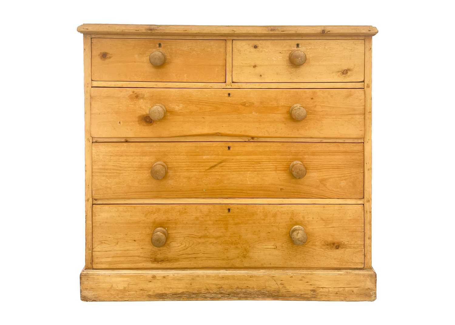 A pine chest of two short and three long drawers.