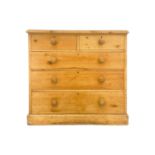 A pine chest of two short and three long drawers.