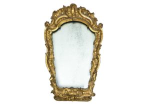An 18th century baroque wood carved gesso gilt mirror.