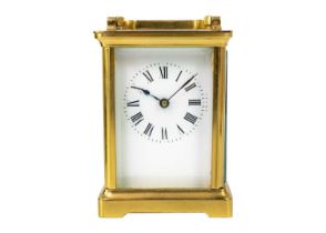 A French brass cased carriage timepiece.