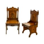A pair of late Victorian aesthetic movement oak side chairs.
