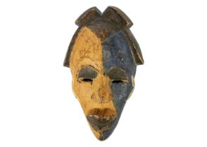 An African wood carved mask.