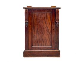 A Victorian mahogany pedestal cupboard.