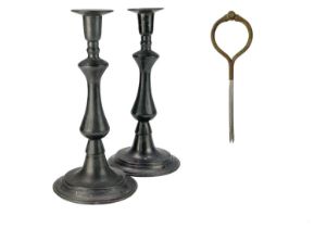 A pair of Georgian style pewter baluster candlesticks.