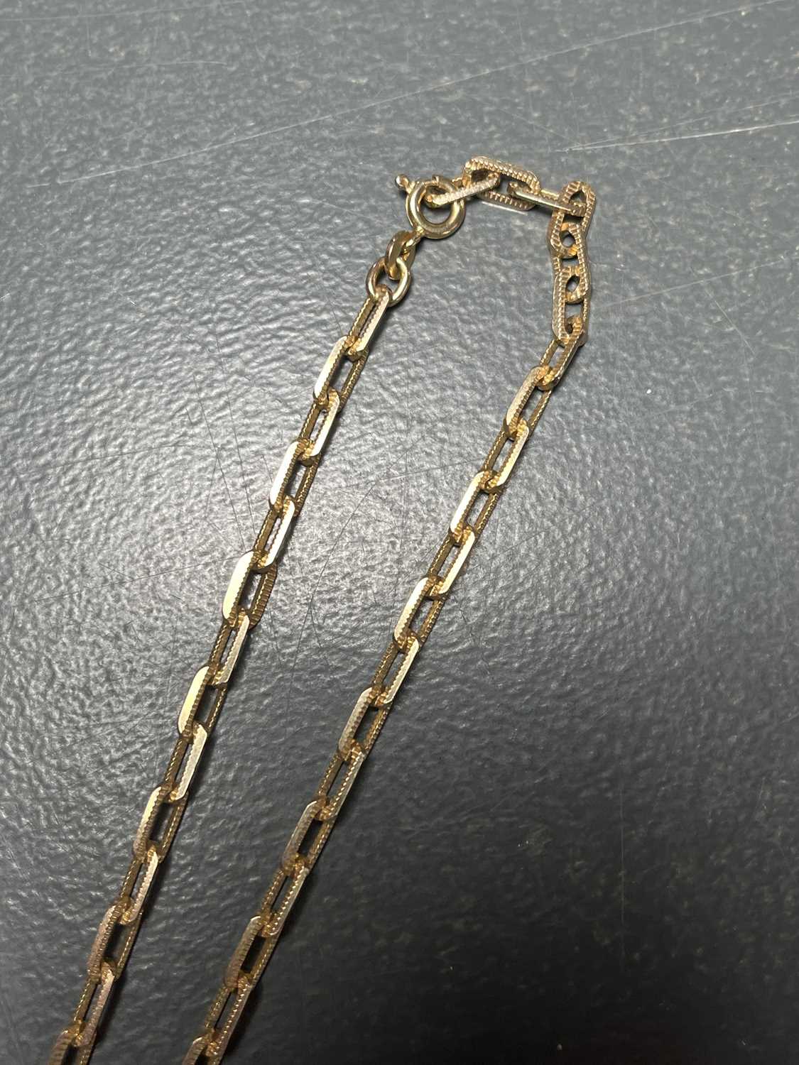 A 10ct gold rectangular textured link necklace. - Image 6 of 6