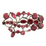 A Georgian silver foiled garnet flower brooch.