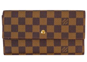 LOUIS VUITTON - A Damier Ebene Sarah wallet.