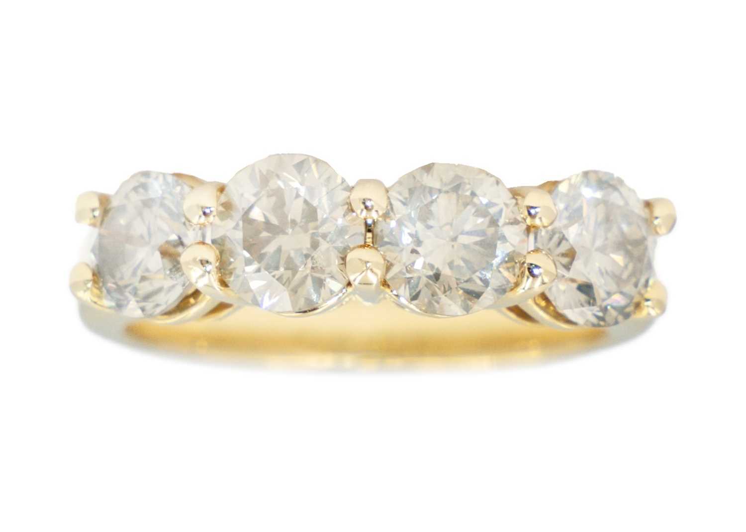 An 18ct diamond set four stone ring,