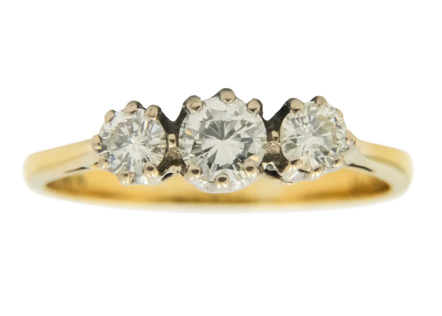 An 18ct diamond set three-stone ring.