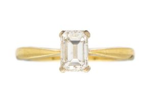 A modern 18ct emerald cut diamond solitaire ring.