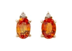 A pair of orange sapphire and diamond set 9ct rose gold earrings.