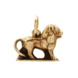 A high purity gold (tests 18ct) lion charm pendant.