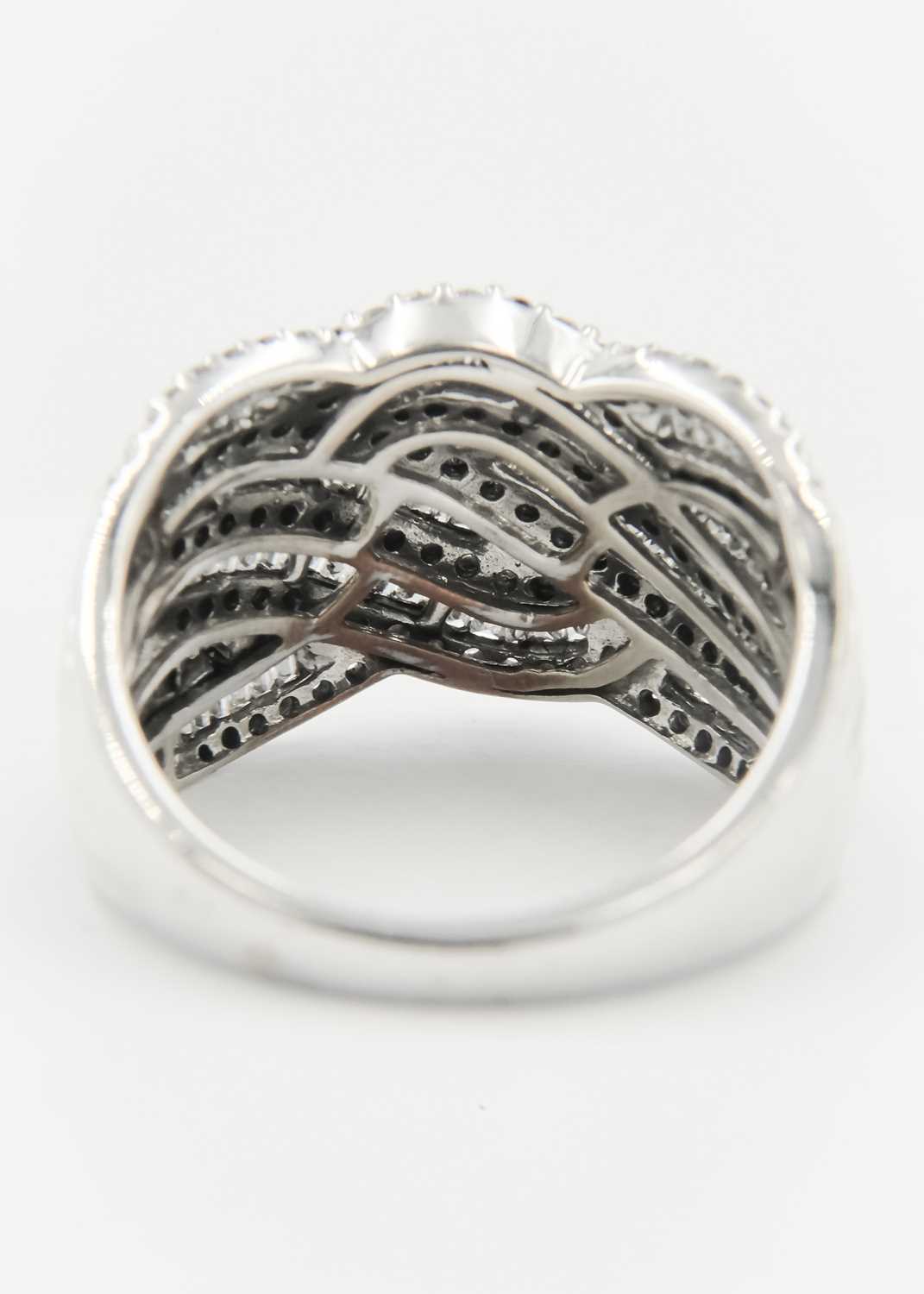 A 9ct white gold diamond set wave design dress ring. - Image 2 of 5