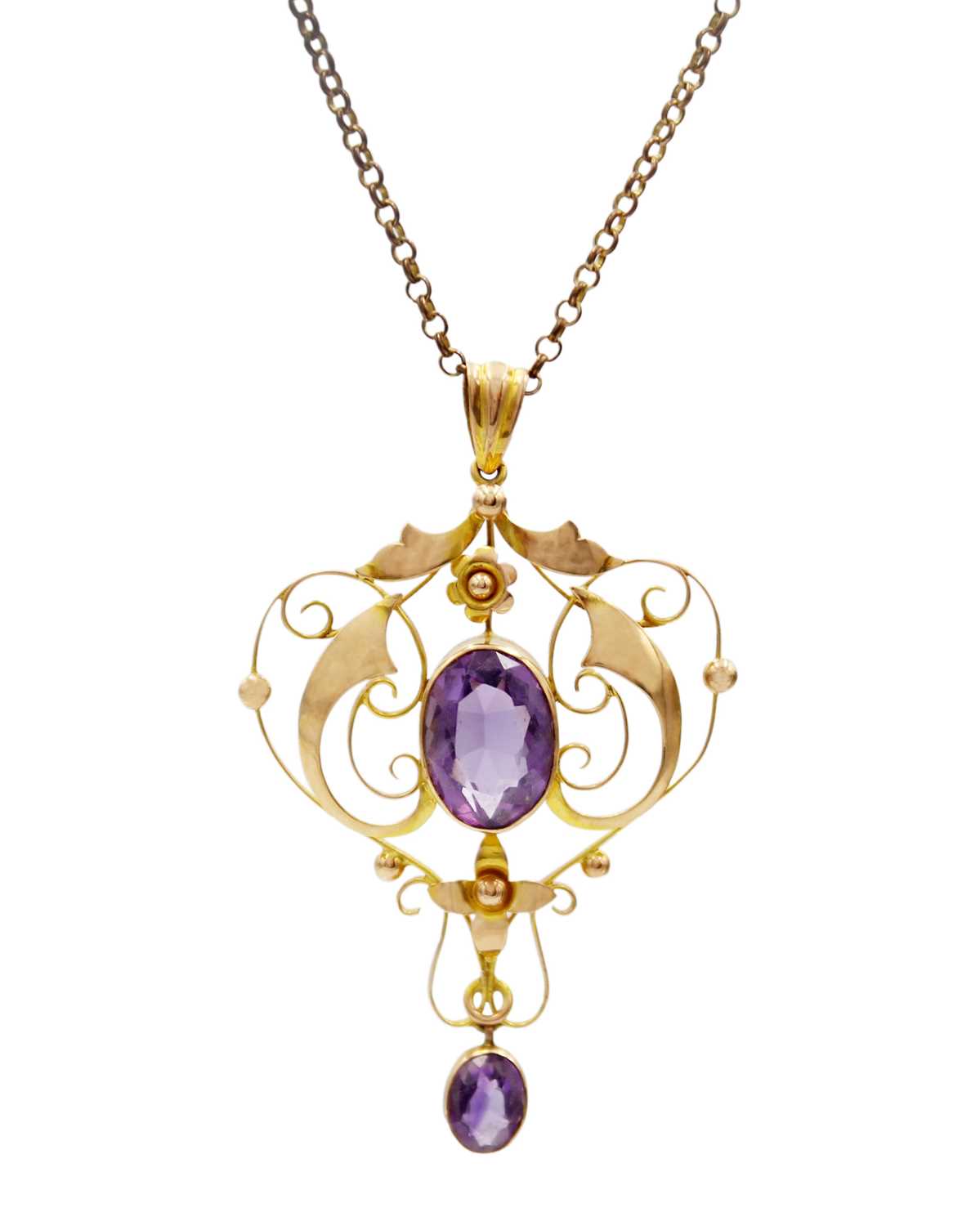 A 9ct amethyst set Art Nouveau openwork pendant on 9ct necklace.