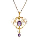 A 9ct amethyst set Art Nouveau openwork pendant on 9ct necklace.